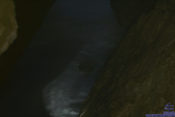 An opening in the middle of the cave. Do you see the face?